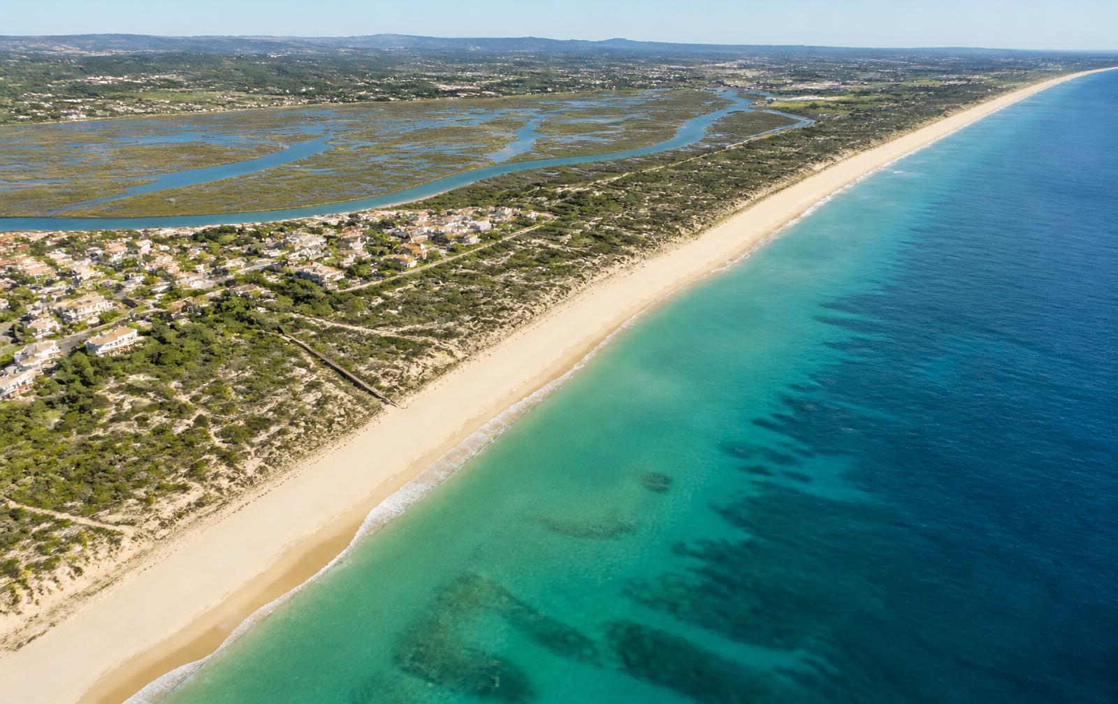 Aerial view of the Meia Praia coastline stretching towards Lagos